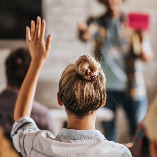 Woman raising hand